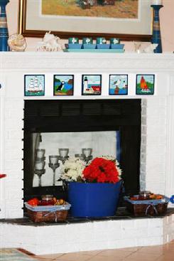 Fireplace tile installation using Besheer Art Tile Nautical Designs